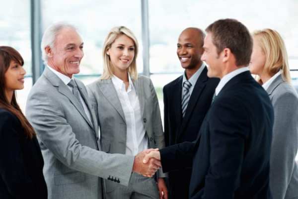 Business people shaking hands after successful negotiations