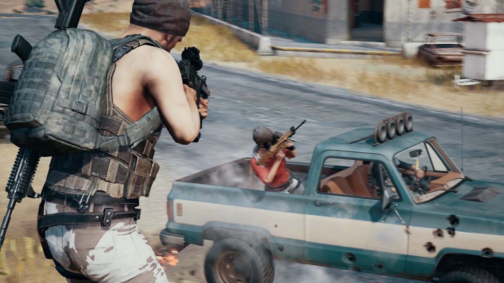 A player shooting another player in a truck in PUBG