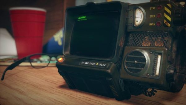 Fallout 76: A Robco Pip Boy 3000, playing the song Take Me Home, Country Roads on Vault-Tec Radio as an alarm. The date is set to October 27, 2102