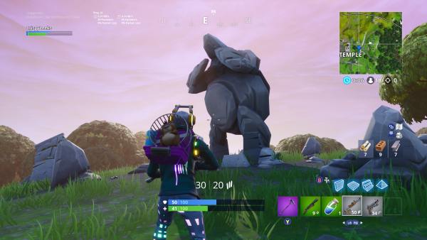 Where to Search Between Giant Rock Man Crowned Tomato Encircled Tree in Fortnite
