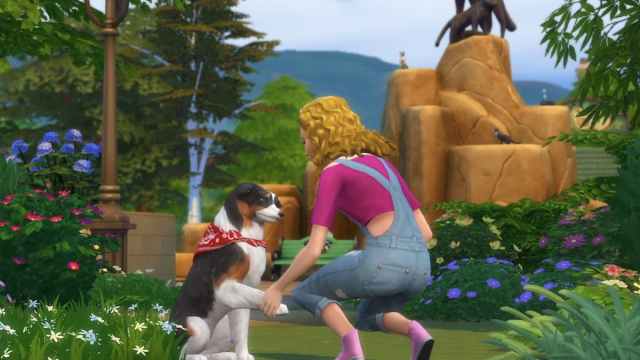 Sim playing with her dog.
