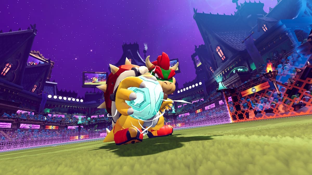 Bowser holds the ball in his right hand