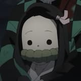 Nezuko with a rope in her mouth with cute little eyes