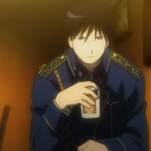 Roy having a drink and looking upset