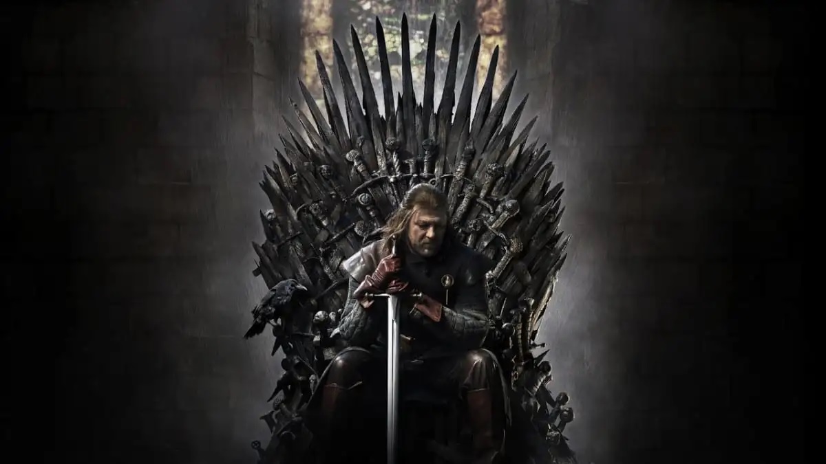 Ned Stark in Game of Thrones sitting atop the Iron Throne