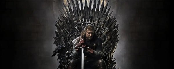 Ned Stark in Game of Thrones sitting atop the Iron Throne