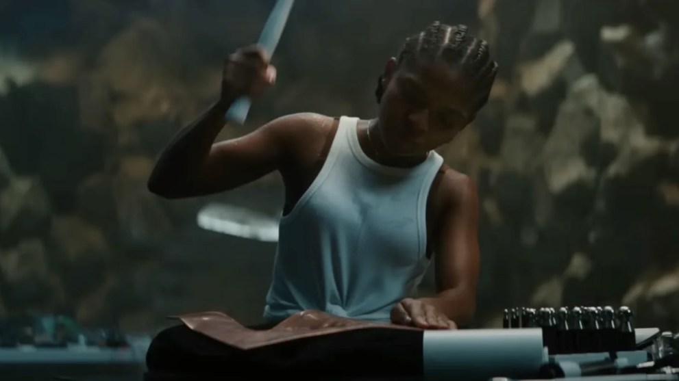 Riri Williams working on her suit in Black Panther: Wakanda Forever