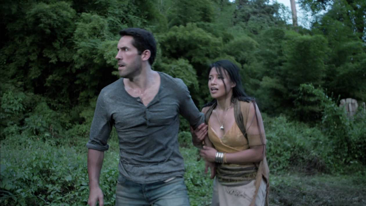 Scott Adkins as Wes Baylor and Ann Truong as Tha on Hard Target 2