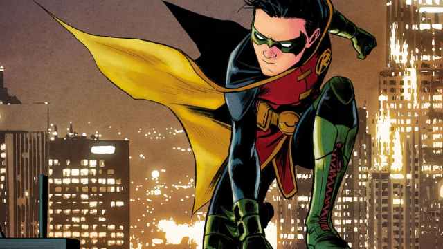Damian Wayne as Robin appears in a heroic stance with a Gotham backdrop