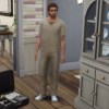 a Sim standing by an open luggage in Sims 4 Growing Together.