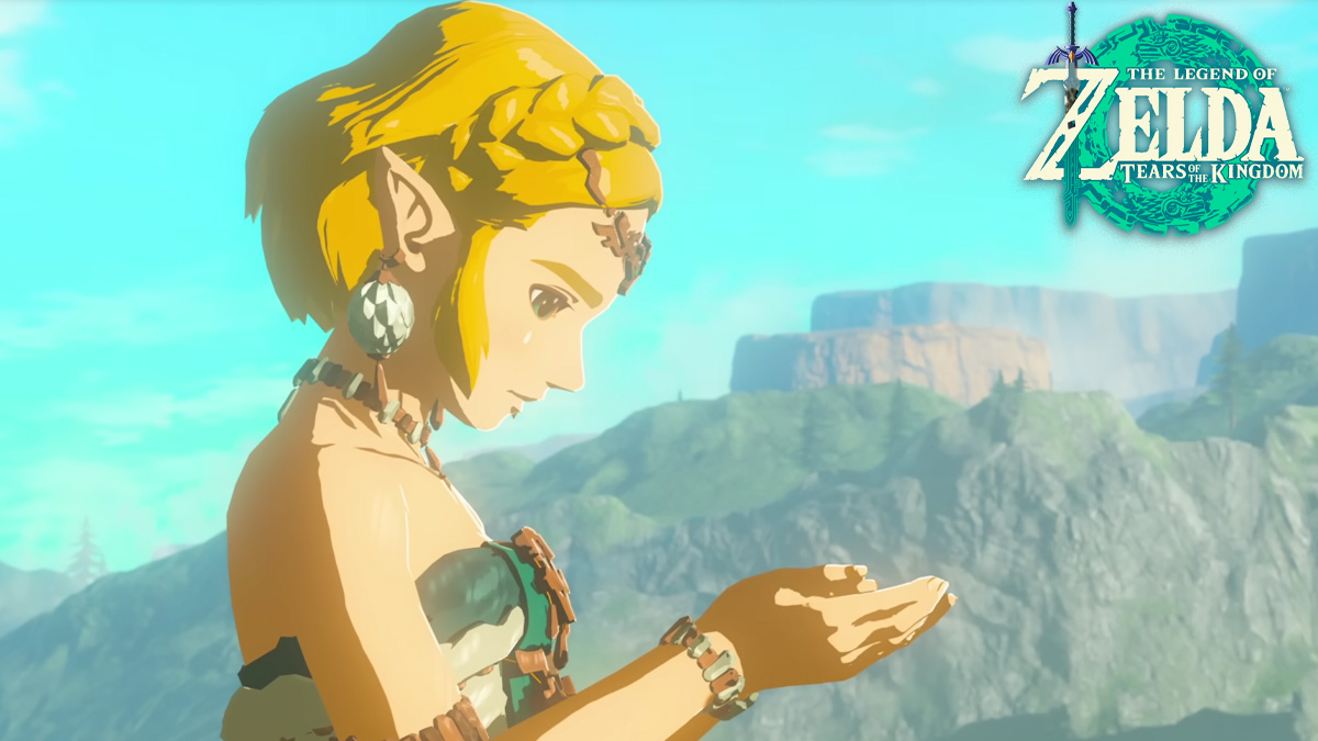 Zelda looking at item in her hands next to Tears of the Kingdom logo