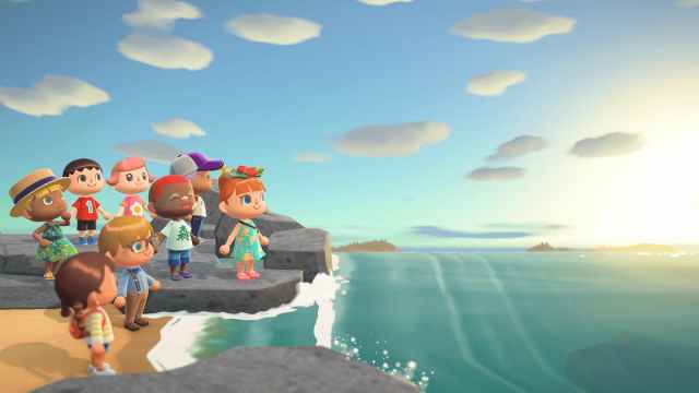 Villagers looking out to the sunset in Animal Crossing: New Horizons