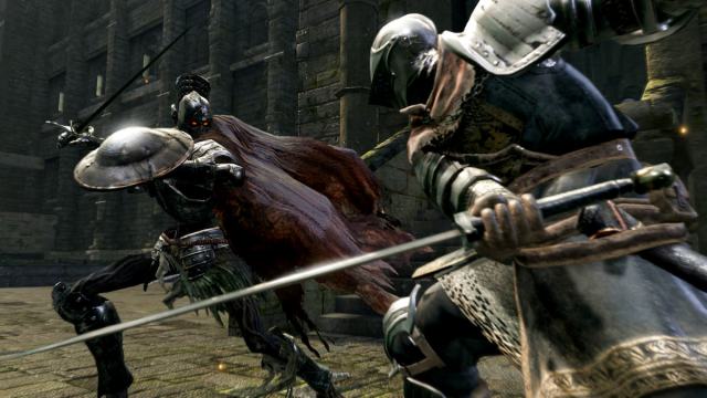 A player in Dark Souls fighting a difficult enemy