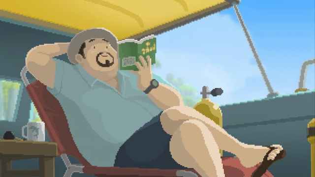 Dave the Diver relaxes peacefully while reading a nice book