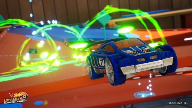 cars racing through rings on hot wheels track