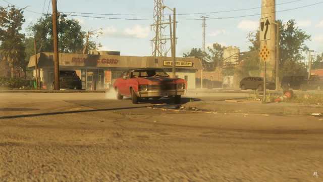 A car driving across a dusty parking lot in GTA 6.