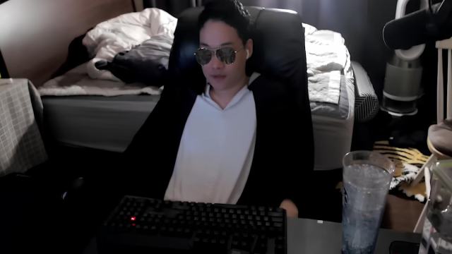 Dopa using a filter for fake sunglasses and wearing his signature pajama while streaming