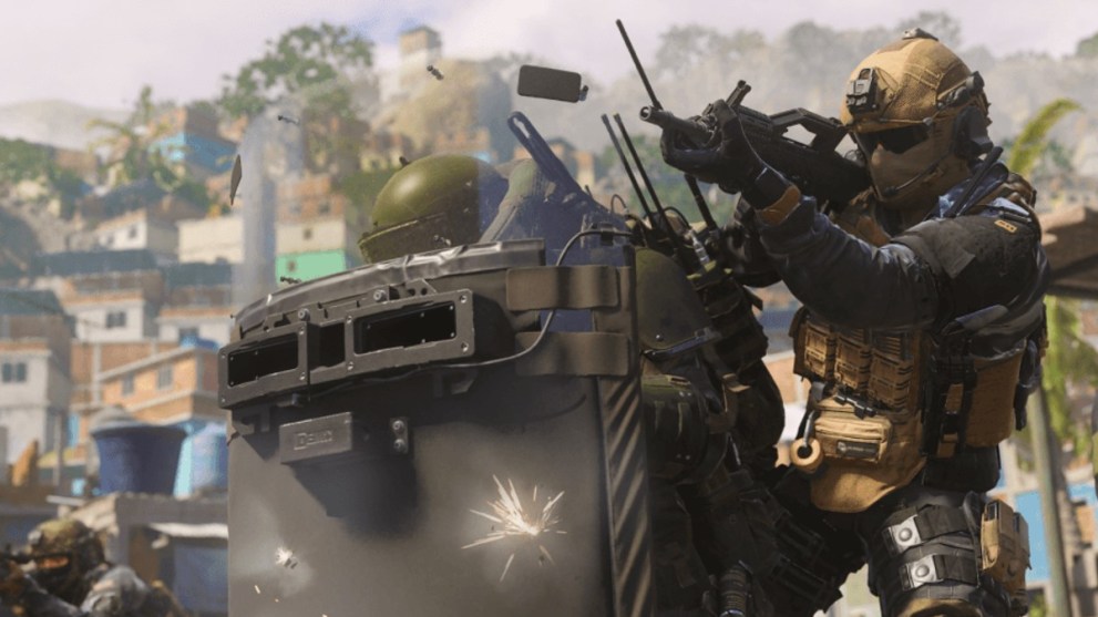Soldiers firing weapons behind a riot shield in MW3.