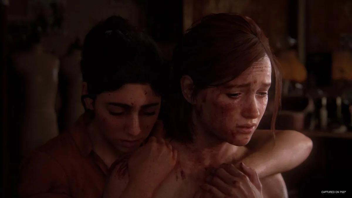 Dina and Ellie embracing in The Last of Us Part II