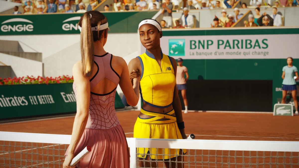Two players shaking hands by the net in TopSpin 2K25.