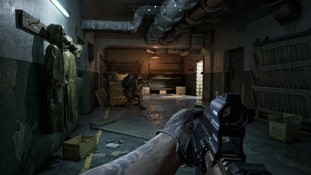 Soldiers walking through a dark warehouse in Gray Zone Warfare.