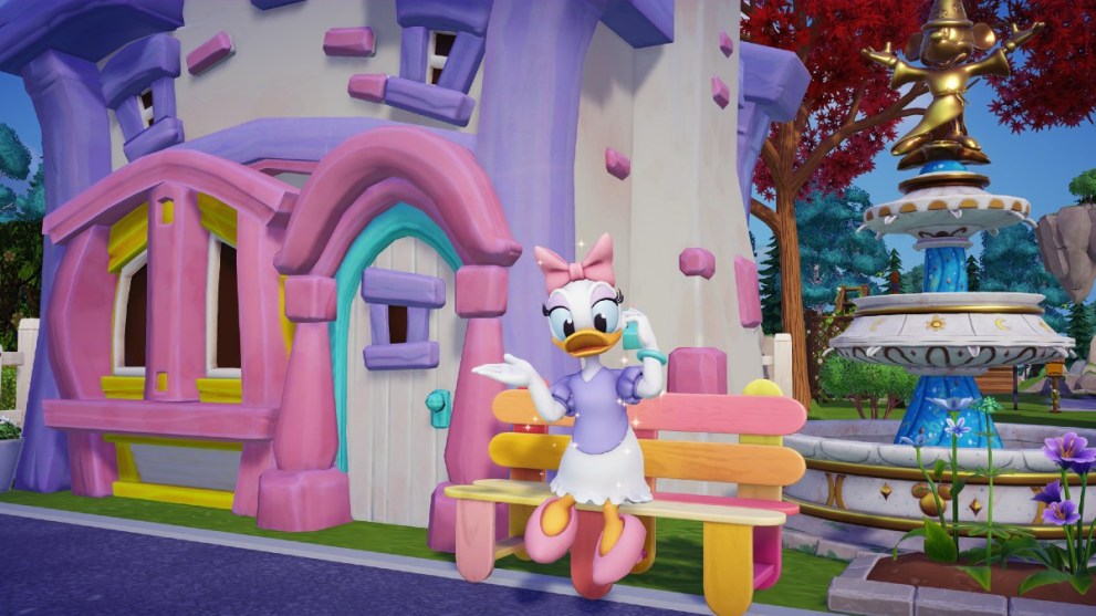Daisy sat outside her house in Disney Dreamlight Valley.