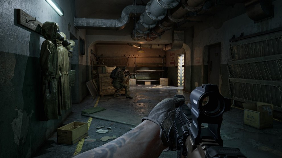 A soldier aiming a gun down a hallway in Gray Zone Warfare.