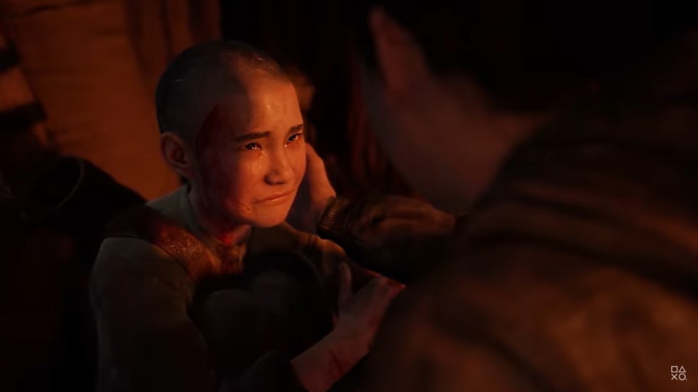 Abby touching Lev's face in The Last of Us