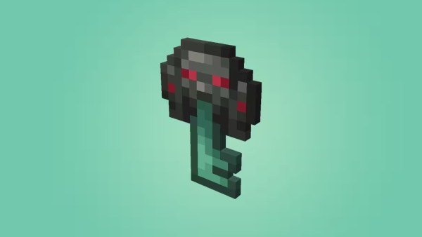 Minecraft Ominous Vault Trial Key on turqoise background