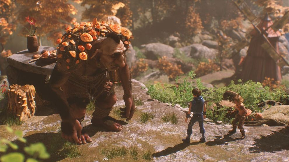Due fratelli in piedi accanto al troll in Brothers: A Tale of Two Sons Remake