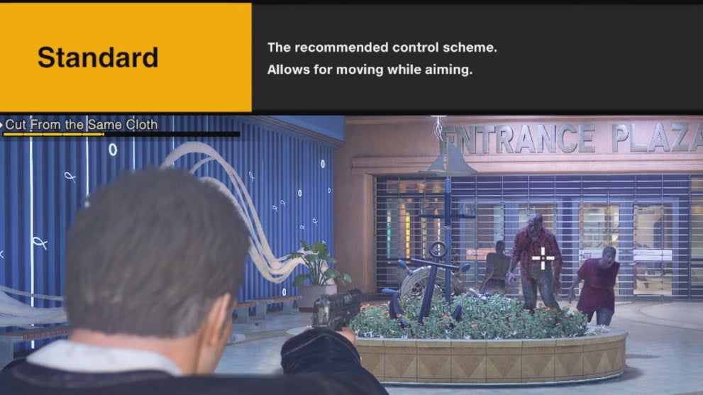 Frank West aiming at zombies with a bar on top explaining recommended controls.