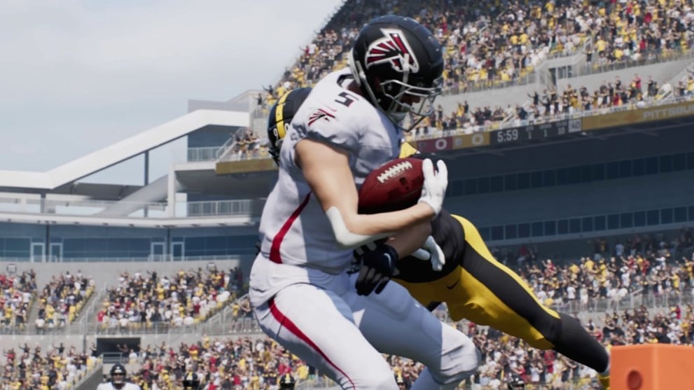 Player with a ball being tackled by another player in black